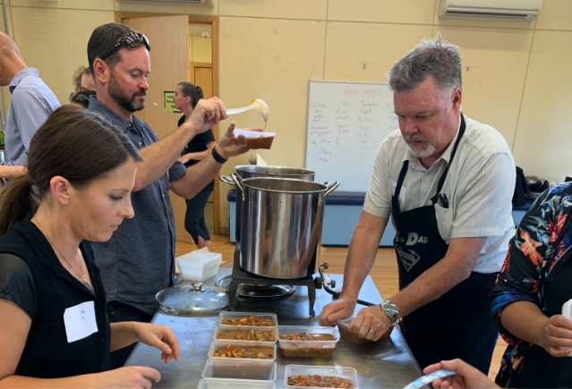 Volunteers prepare meals with rescued food at Fair Food NZ