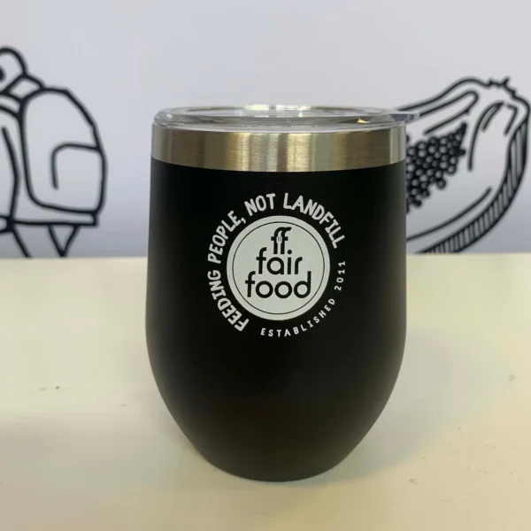 Black cup with rounded bottom and white Fair Food label